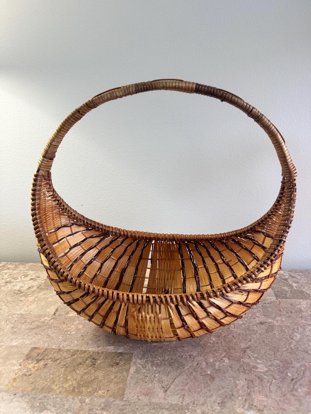 Vintage crescent-form or half-moon wicker gathering basket with handle